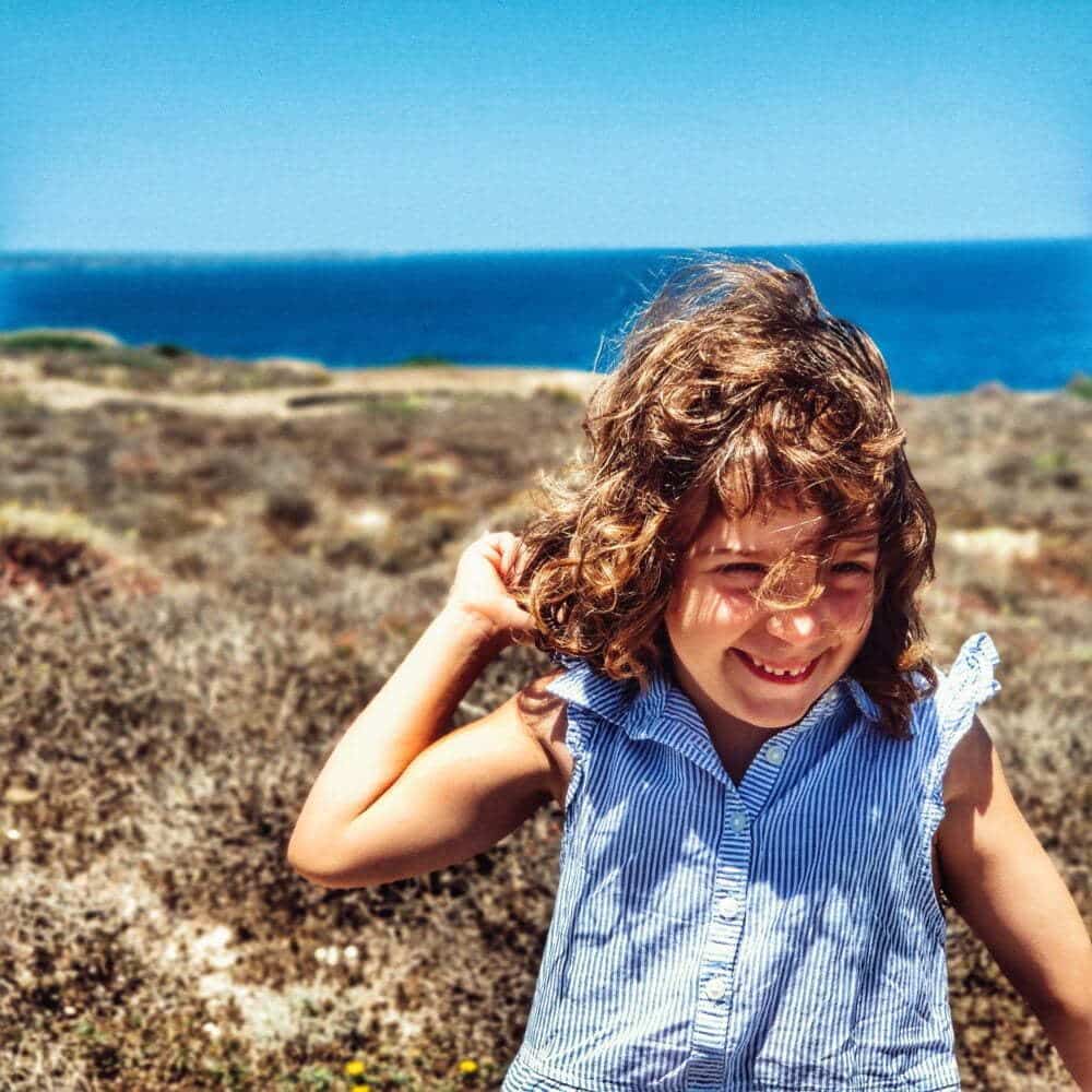 Anna with the breathtaking views of the Isabel II fortress in Menorca