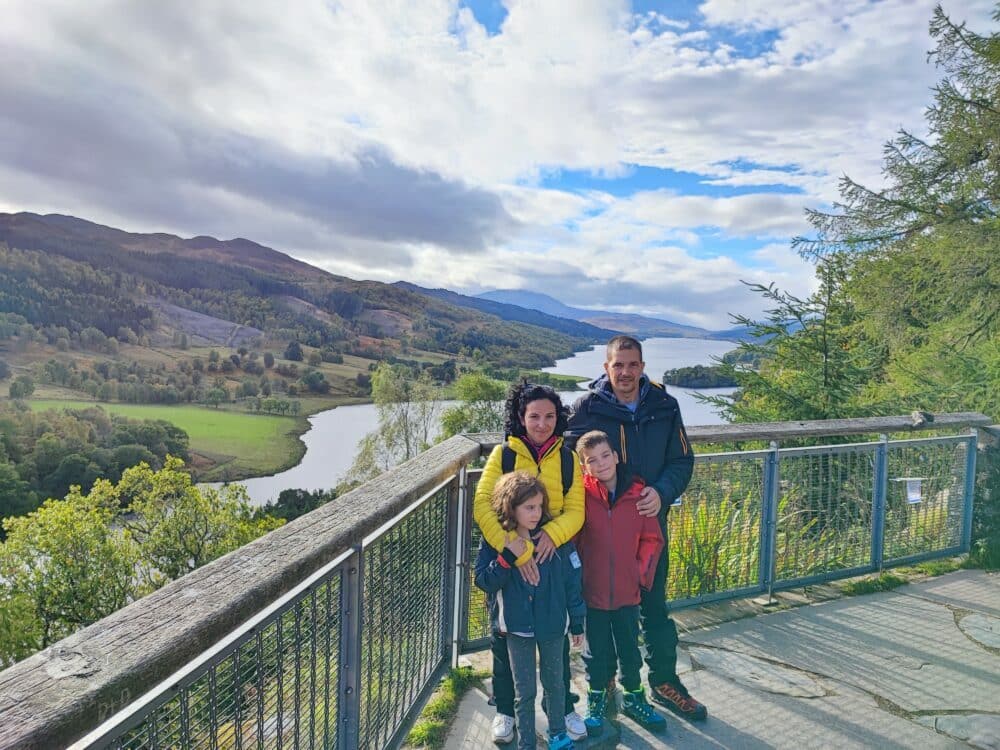 Scotland with the family, at the Queen's Viewpoint over the river and Loch Tummel