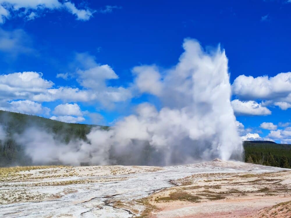 The Old Faithfull geyser exploding during our visit to Yellowston National Park during our motorhome route through the US